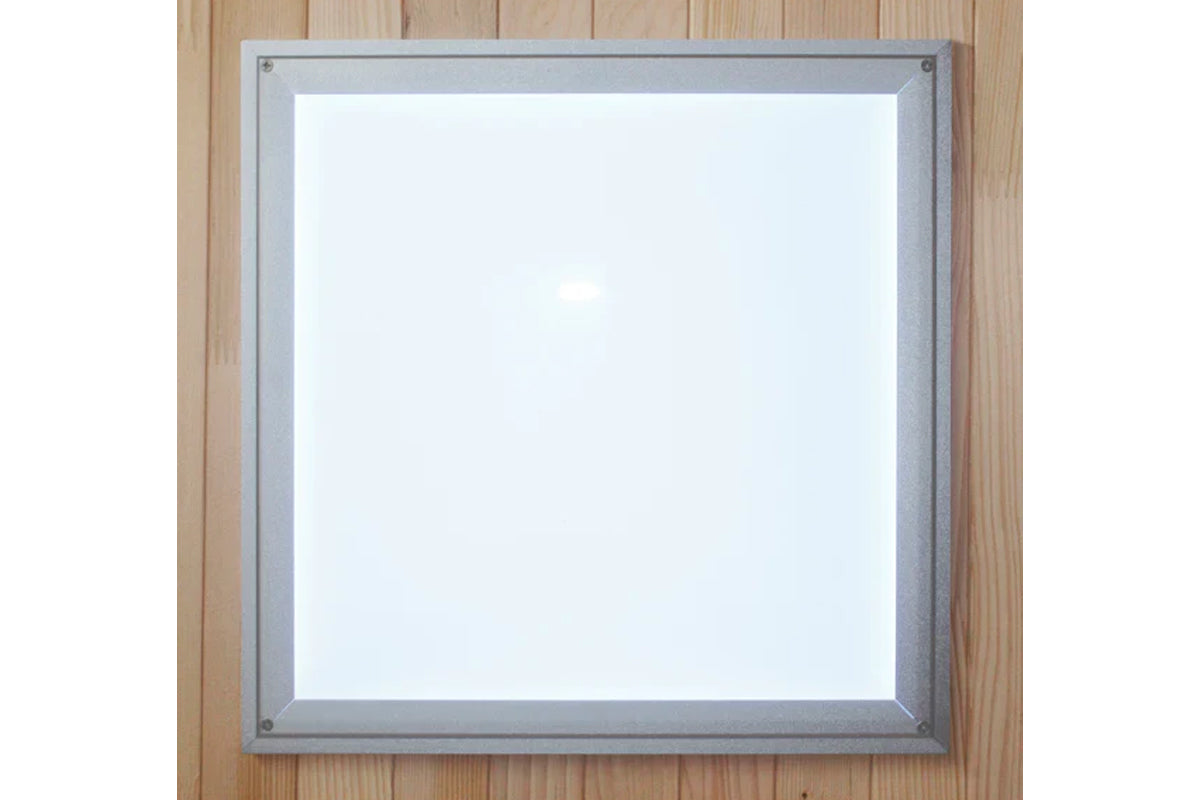 Gray aluminum-framed sauna control panel with white display screen on wooden wall