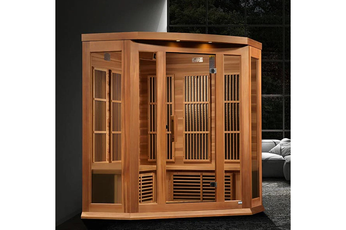 Cedar wood corner sauna with glass doors, vertical slat panels, and louvered vents in modern interior setting