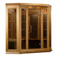 Light wood corner infrared sauna with glass doors and vertical slat interior panels on white background