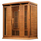 Cedar wood infrared sauna cabin with glass doors, two vertical heater panels, horizontal wood siding, and overhead lighting o