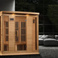 Four-person infrared sauna with natural wood construction, vertical slat doors, control panel, and built-in lighting in moder