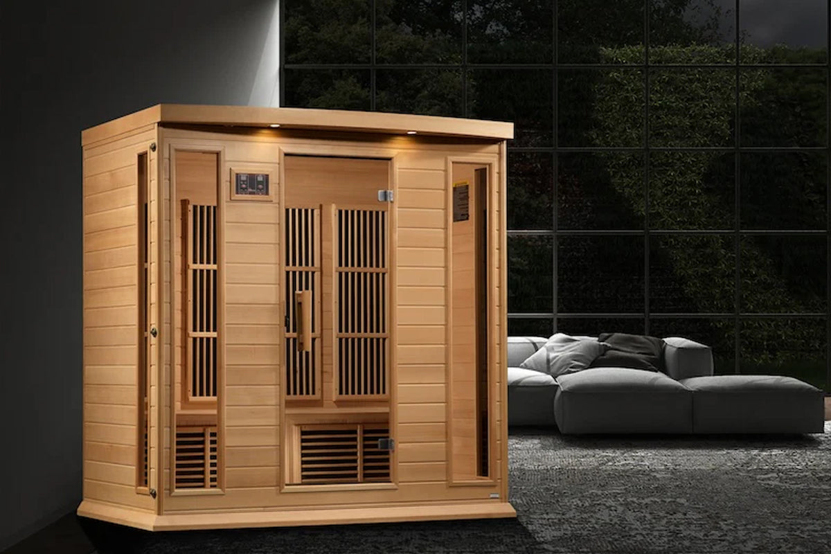Four-person infrared sauna with natural wood construction, vertical slat doors, control panel, and built-in lighting in moder
