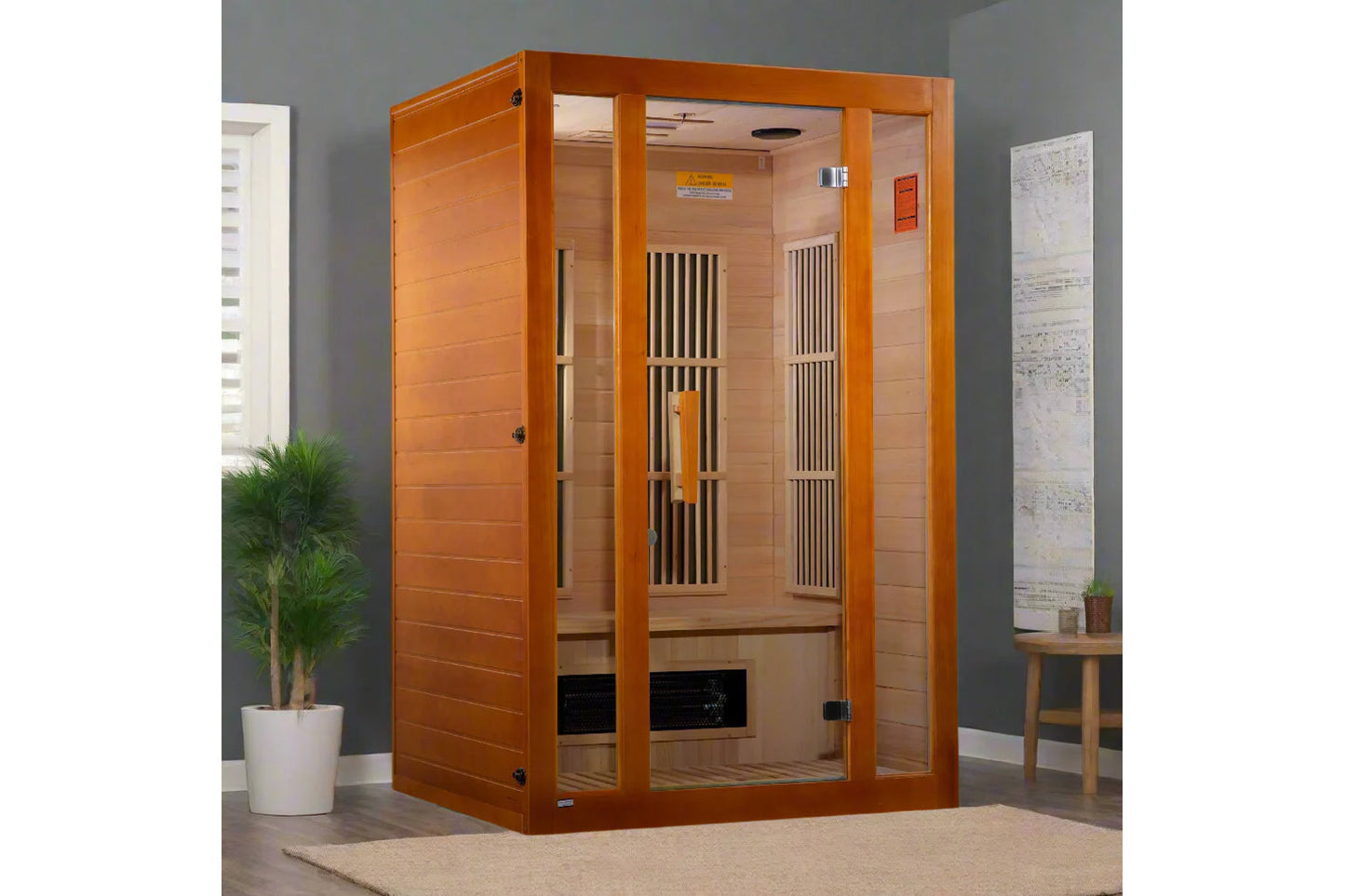 Orange wood two-person infrared sauna with glass doors and wooden bench interior, displayed in home setting