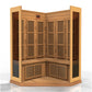 Corner sauna cabin with light wood frame, vertical slatted door panels, louvered vents on lower section, and wooden bench sea