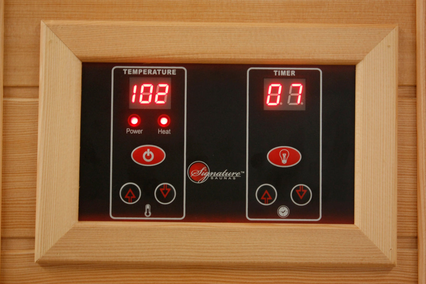 Signature Saunas digital control panel with temperature and timer displays in natural wood frame