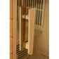 Light wood cylindrical pull handle on sauna door with metal mounting brackets