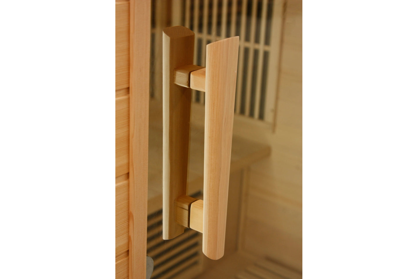 Light wood cylindrical pull handle on sauna door with metal mounting brackets