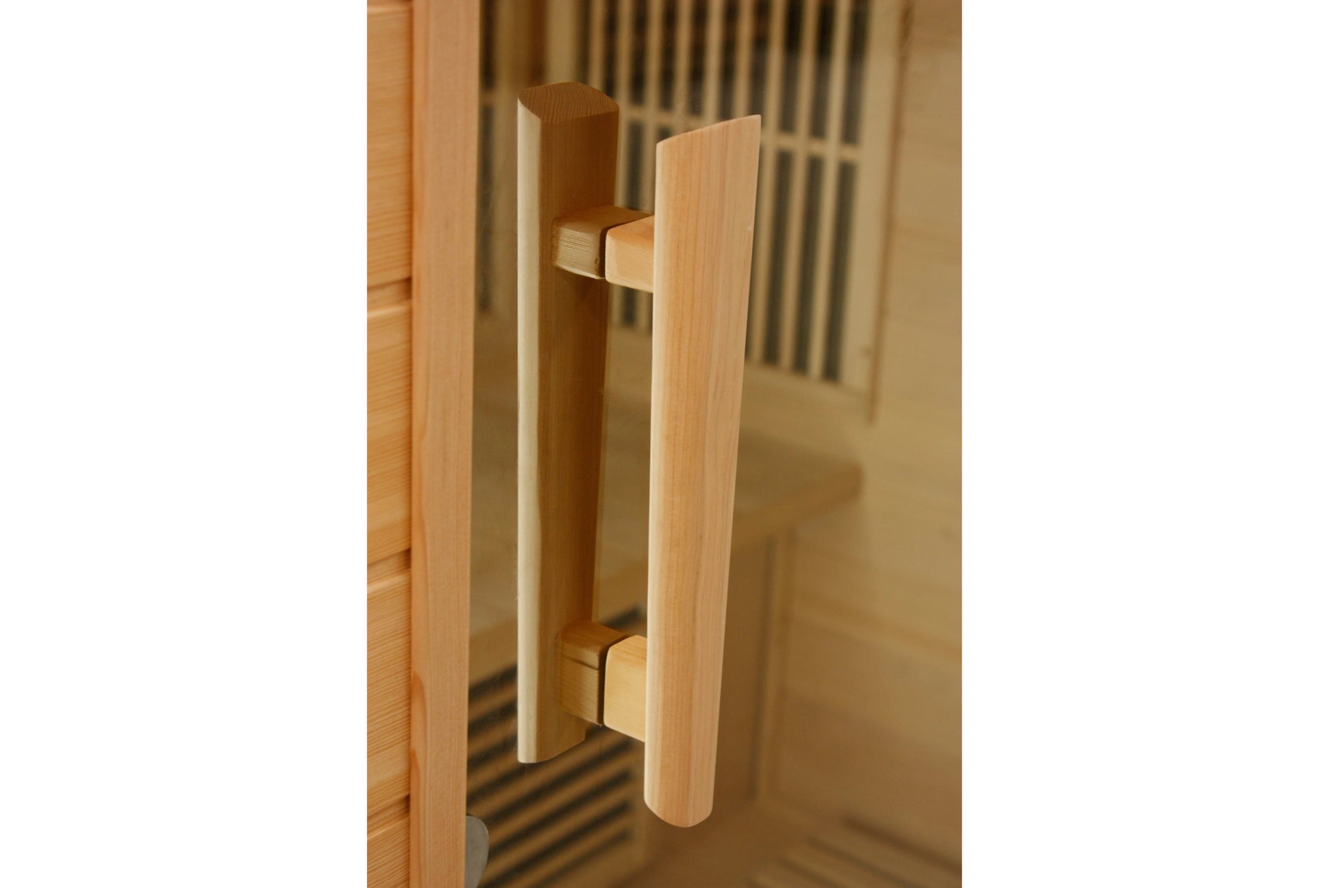 Light wood cylindrical pull handle on sauna door with metal mounting brackets
