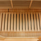 Natural wood sauna interior with slatted bench seating and horizontal ceiling vents, overhead view