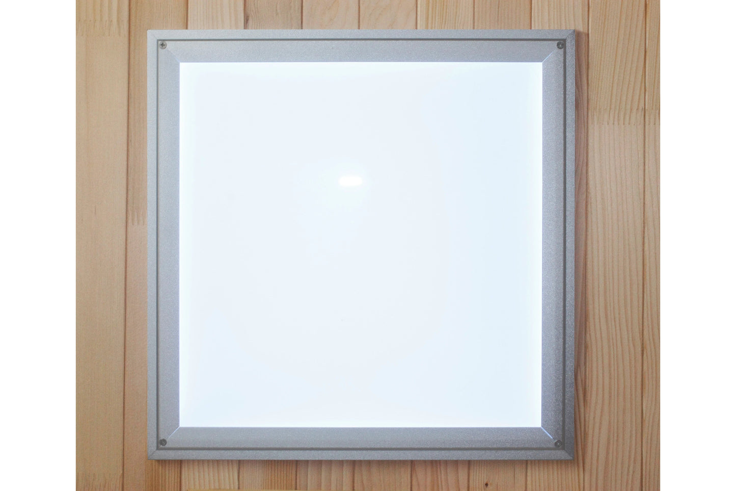 Silver-framed mirror with white reflective surface mounted on wooden wall background