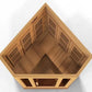 Wooden 3-person corner sauna with peaked roof, ventilation grilles on interior walls, and dark glass front panel on white bac