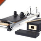 Black and cream Merrithew SPX home pilates reformer with carriage, footbar, and accessories on white background, marked sold