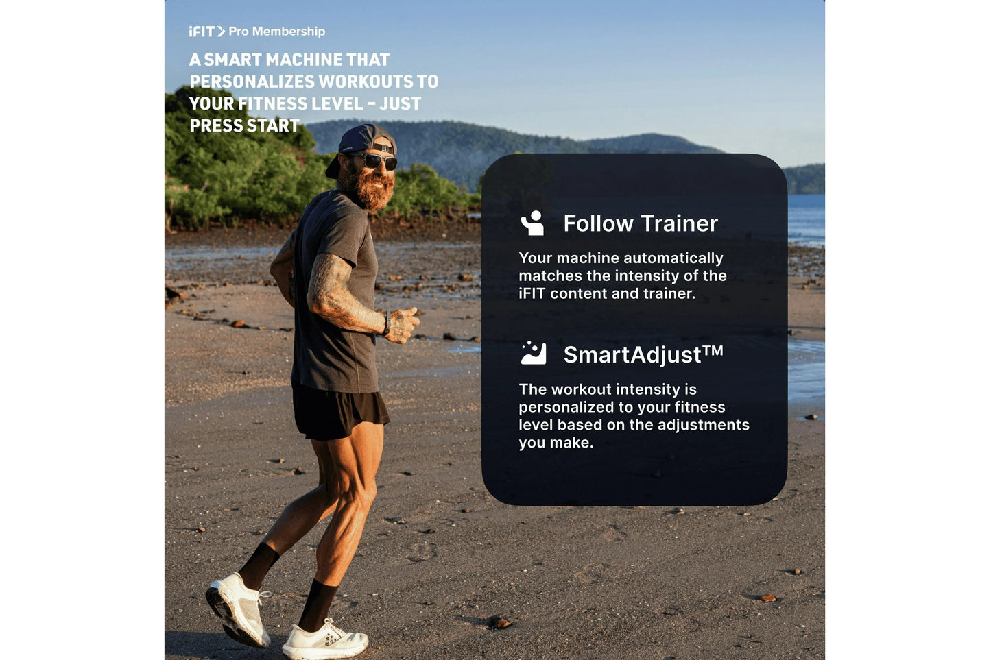 Male runner jogging on beach in dark shirt and shorts, wearing sunglasses and cap, with mountains and water in background, pr