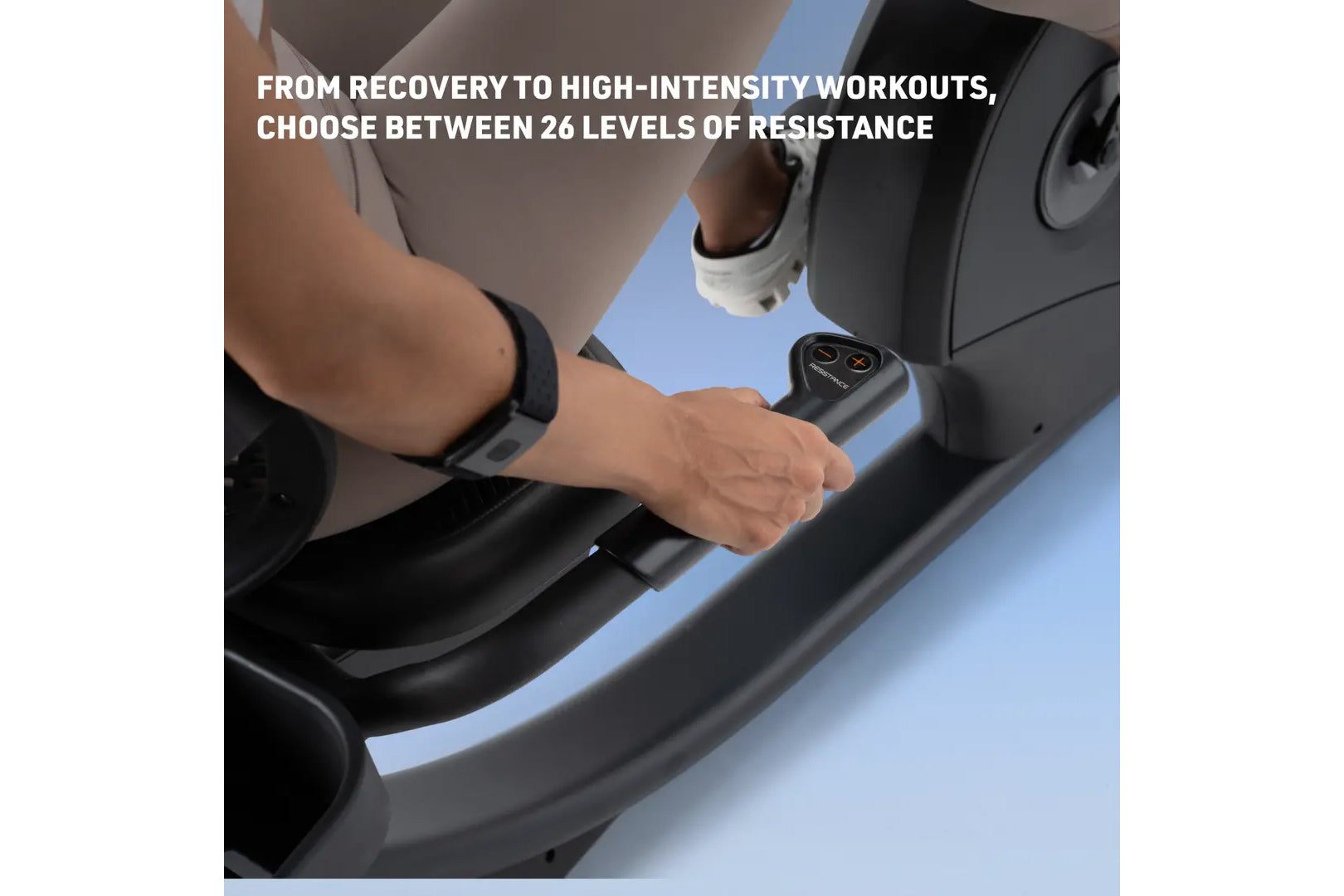 Person using black recumbent exercise bike with digital control console, adjustable resistance handlebar, worn by model durin