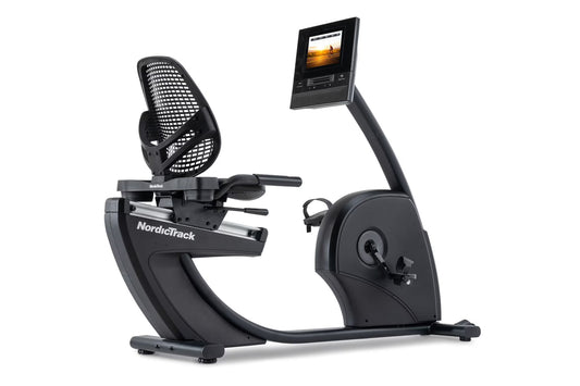 NordicTrack recumbent exercise bike with black mesh seat, curved footrest, dual handlebars, and digital display monitor mount