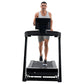 Man running on black NordicTrack Commercial 1250 treadmill with digital display, worn by model on white background