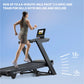 Woman running on black NordicTrack treadmill with digital display showing outdoor scenery, demonstrating incline and decline 