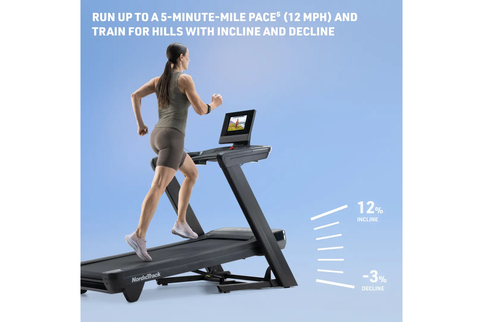 Woman running on black NordicTrack treadmill with digital display showing outdoor scenery, demonstrating incline and decline 