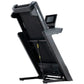 Black NordicTrack Commercial 1250 treadmill with digital display screen and cushioned running deck on white background