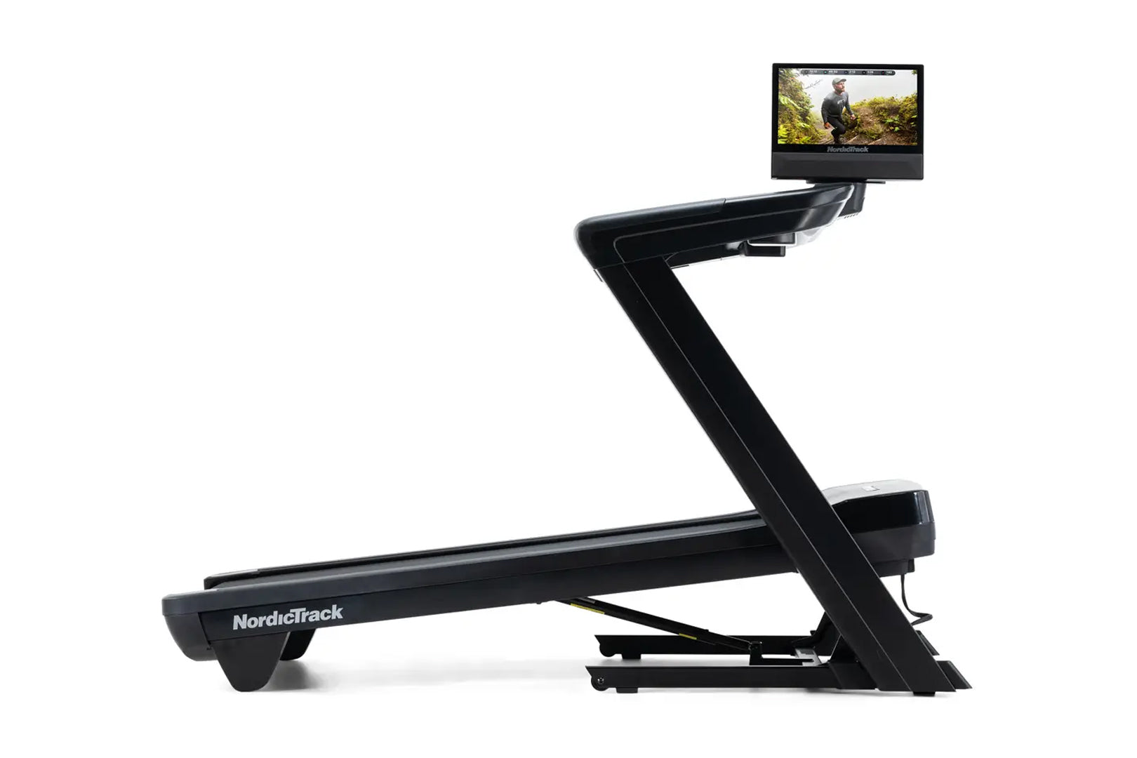 NordicTrack Commercial 1750 black treadmill with attached tablet display showing workout video, on white background