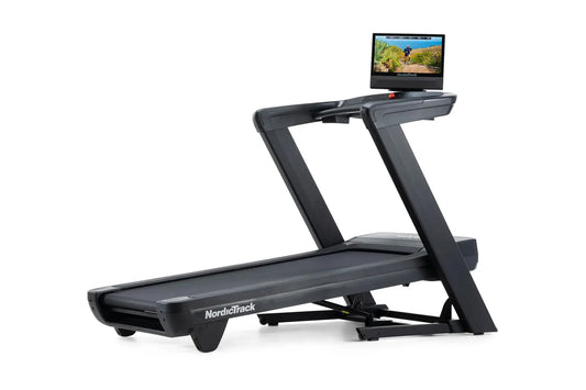 NordicTrack Commercial 1750 black treadmill with attached display screen showing outdoor workout video on white background