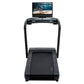 Black NordicTrack Commercial 2450 treadmill with integrated touchscreen display showing workout video, viewed from front on w
