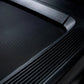 Black treadmill running surface with textured belt and metal handrail detail, flat lay view