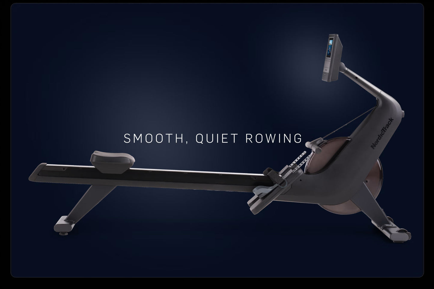 NordicTrack RW600 rowing machine with black frame, digital display monitor, and gray seat on dark blue background