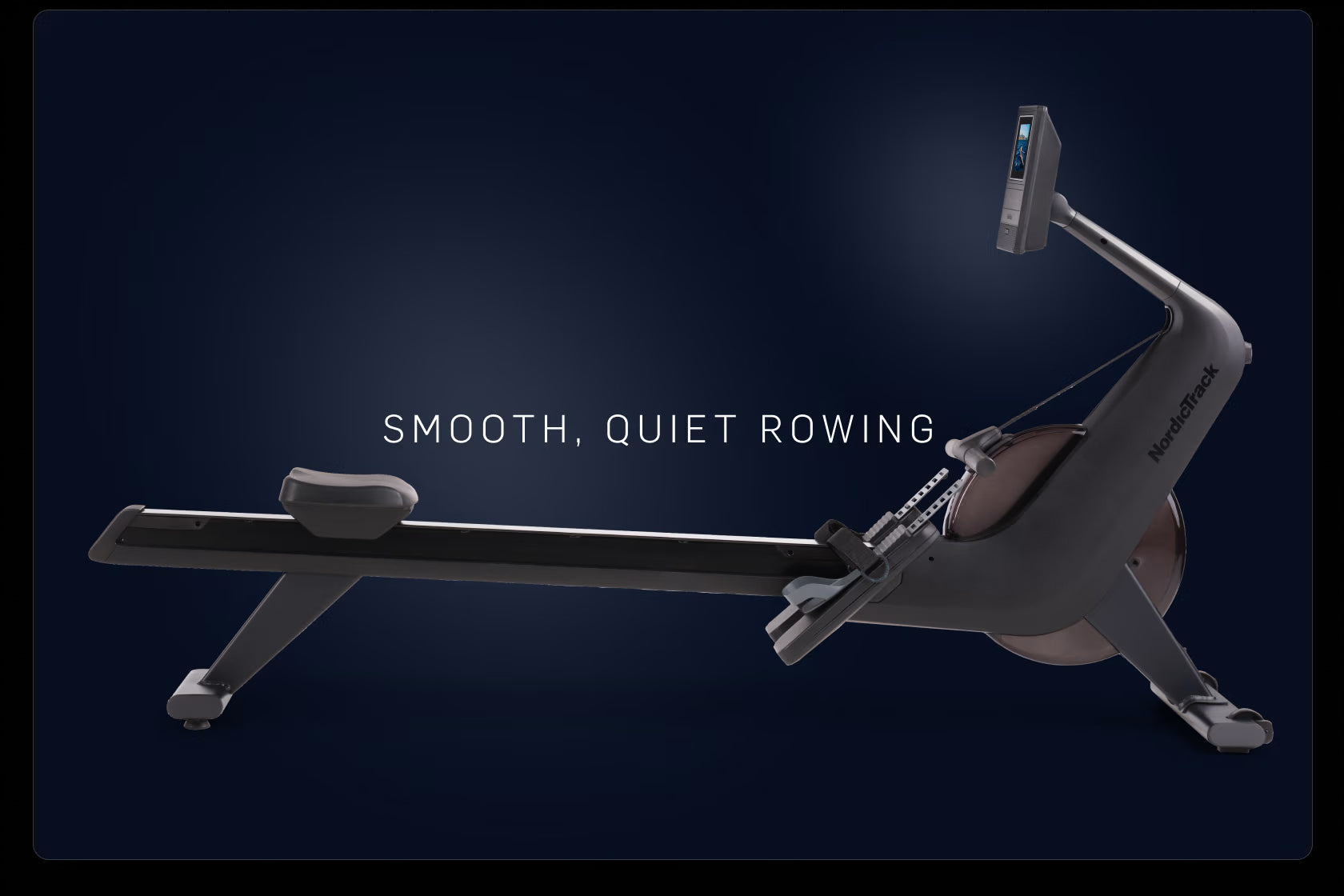 NordicTrack RW600 rowing machine with black frame, digital display monitor, and gray seat on dark blue background