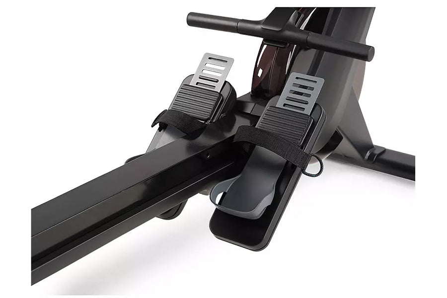 Black and gray rowing machine with dual foot pedals, black handlebar, and digital monitor display on white background