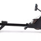 Black NordicTrack RW600 rowing machine with digital monitor, featuring extended seat rail and foot pedals, shown from side vi
