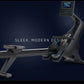 Black NordicTrack RW600 rowing machine with digital display screen on dark blue background