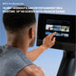 Man touching 10-inch HD touchscreen on NordicTrack rower displaying iFIT Pro workout library with multiple video classes