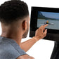 Man wearing gray shirt viewing black rower display screen showing rowing video on white background