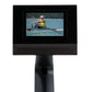 Black digital display stand with adjustable pedestal showing rower workout video on screen