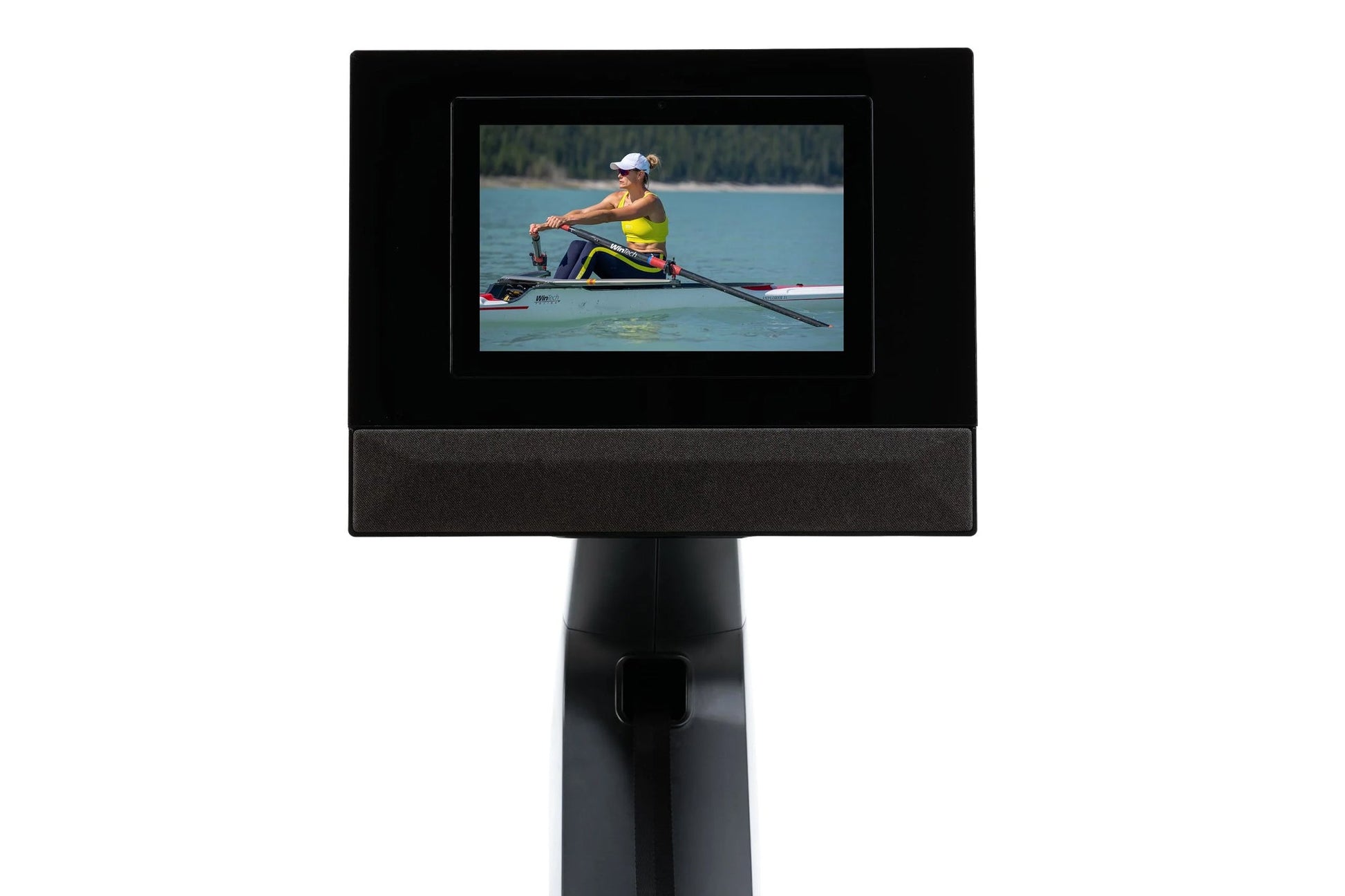 Black digital display stand with adjustable pedestal showing rower workout video on screen