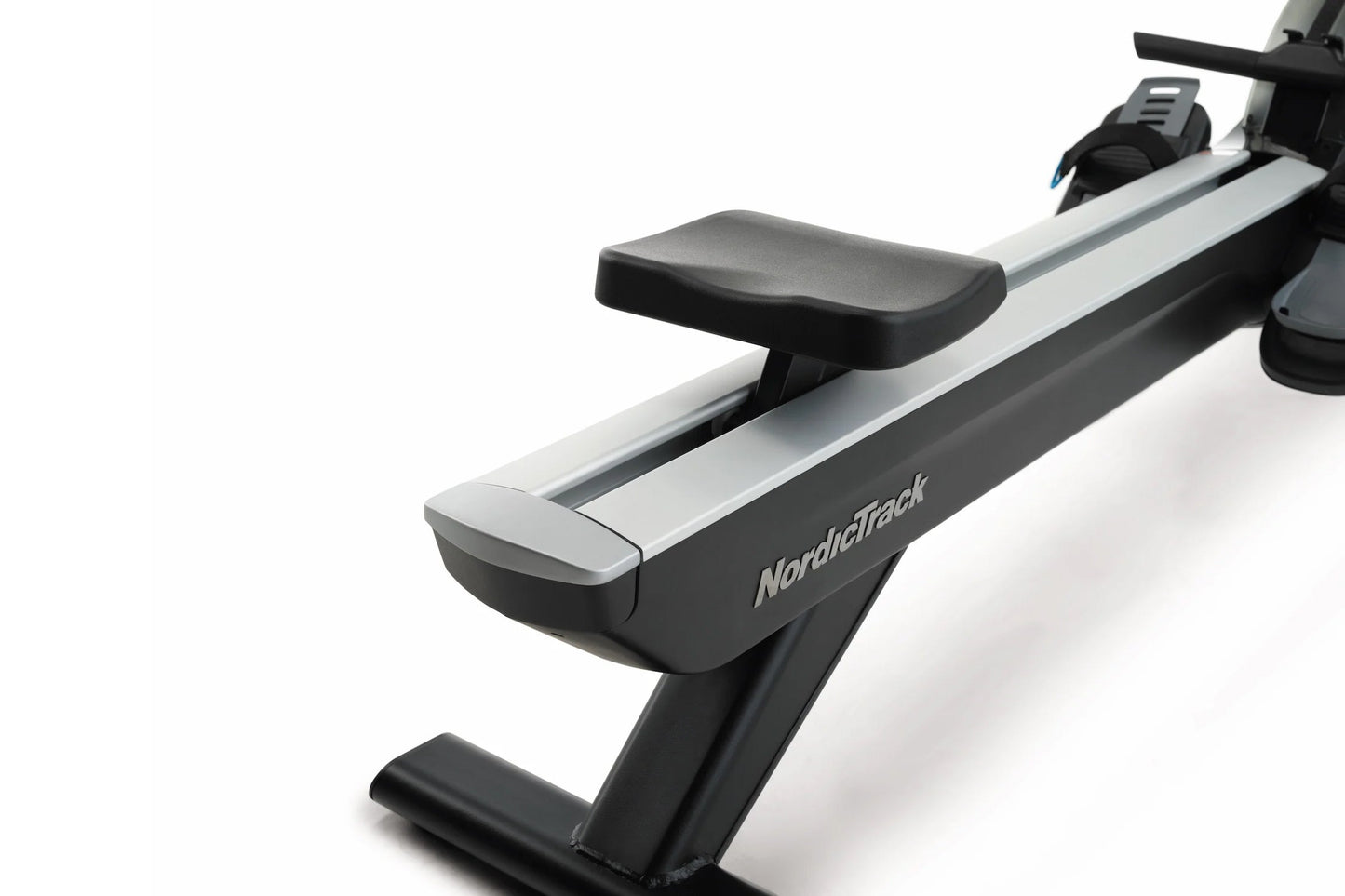 NordicTrack RW900 rowing machine with black and silver frame, padded black seat, and digital console on white background