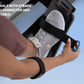 Foot pedal with black adjustable strap attached to NordicTrack rowing machine, worn by model's foot