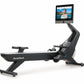 NordicTrack RW900 black rowing machine with gray accents and tablet holder displaying fitness class on white background