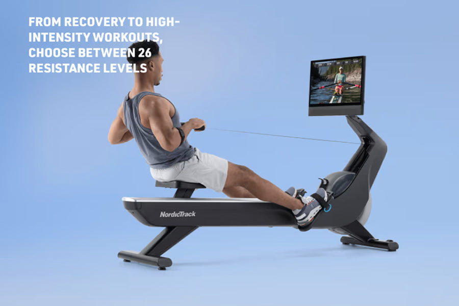 Man using black NordicTrack rowing machine with attached screen display on blue background