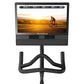 NordicTrack S24 Studio Bike with black frame, curved handlebars, and display screen showing cyclist riding at sunset on white