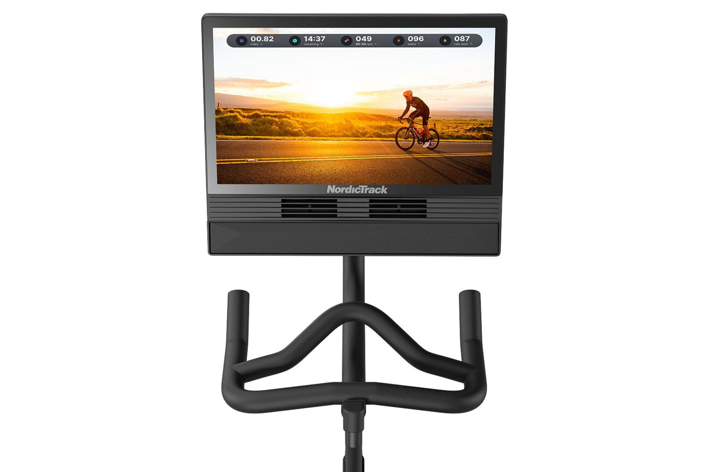 NordicTrack S24 Studio Bike with black frame, curved handlebars, and display screen showing cyclist riding at sunset on white