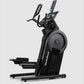 Black NordicTrack Step Climber XL with dual handlebars and large foot pedals on white background