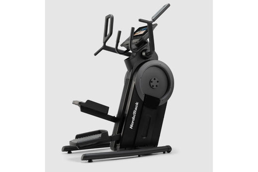 Black NordicTrack step climber with digital display, moving handlebars, and foot pedals on white background