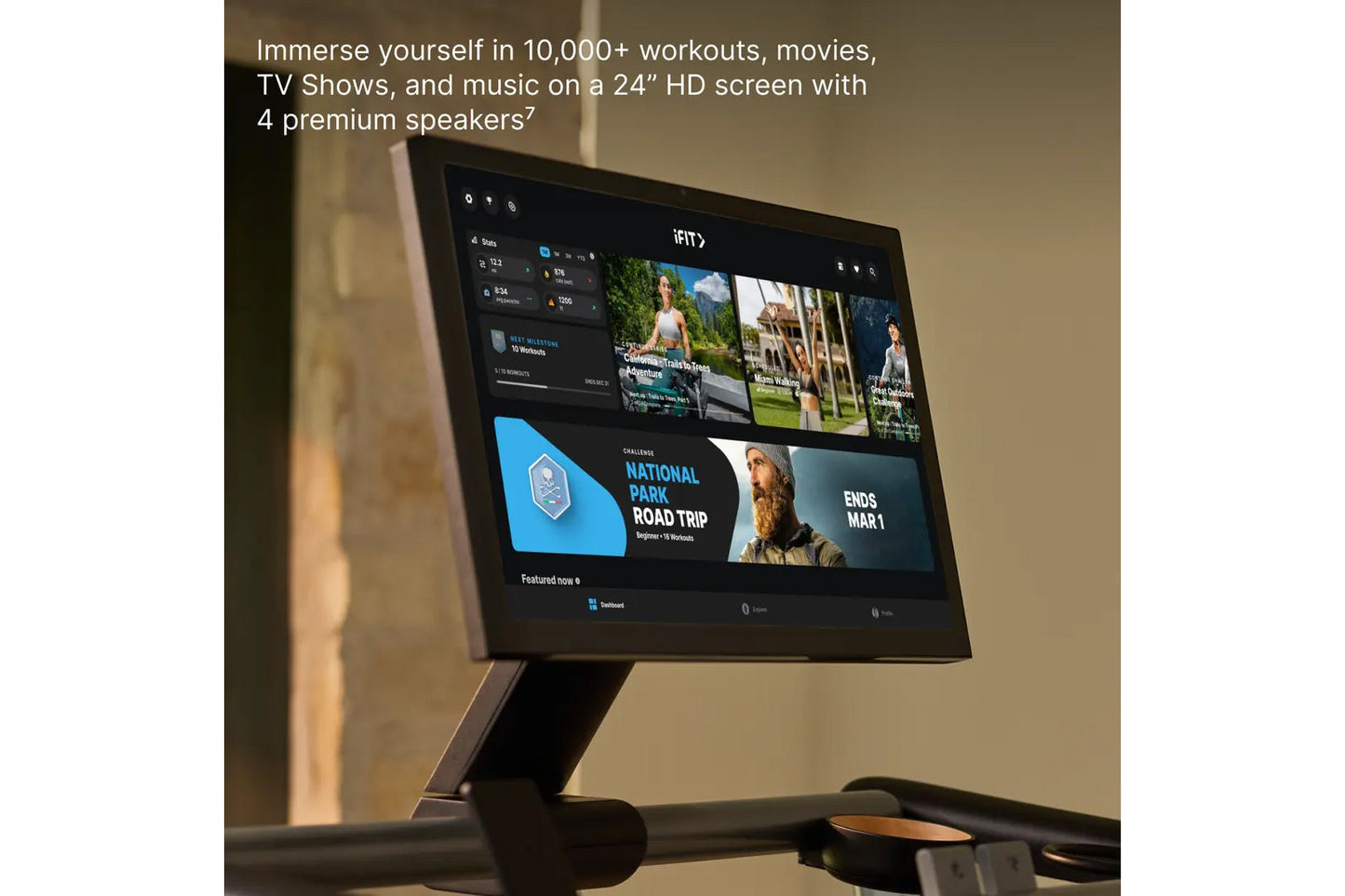 24-inch black HD screen displaying iFIT workout app with videos, challenges, and content library on black pedestal stand