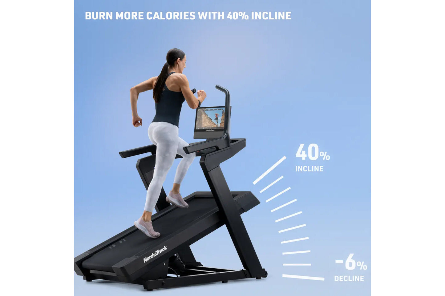 Woman running on black NordicTrack incline treadmill with digital screen against blue background