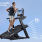 Man running on black NordicTrack incline treadmill with digital screen, demonstrating 40% incline feature against blue backgr