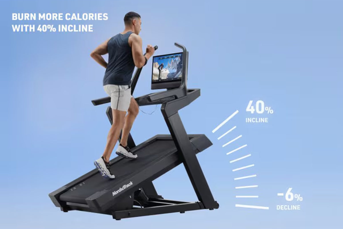 Man running on black NordicTrack incline treadmill with digital screen, demonstrating 40% incline feature against blue backgr