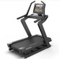 NordicTrack X24 black treadmill with curved frame, digital touchscreen display, and dual handrails on white background