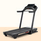 Black ProForm Carbon TLS treadmill with digital display console, dual handrails, and black running belt on beige background